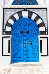 Fototapeten Dekorative blaue Tür. © juri semjonow