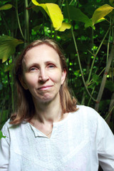 Portrait of a woman on the background of plants