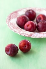 Red plums on a table