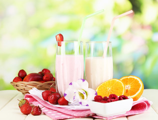Delicious milk shakes with strawberries and orange