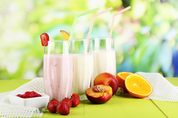 Delicious milk shakes with strawberries and peach