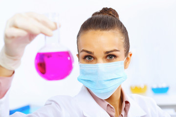 Young female scientist working in laboratory