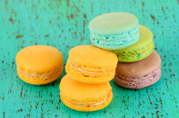 Macaroons on wooden table close-up