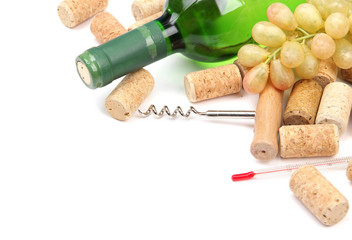 Bottle of wine, grapes and corks, isolated on white