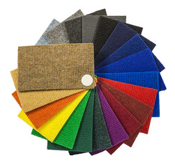 Multi-colored carpeting samples by a fan