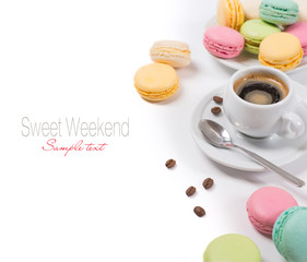 Colorful french macaroons and coffee espresso