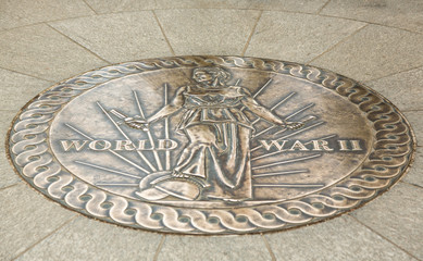 Seal at World War II memorial with feet