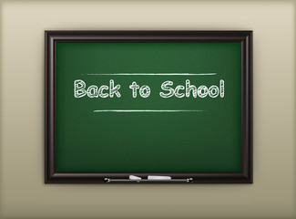 School blackboard with inscription “back to school”,