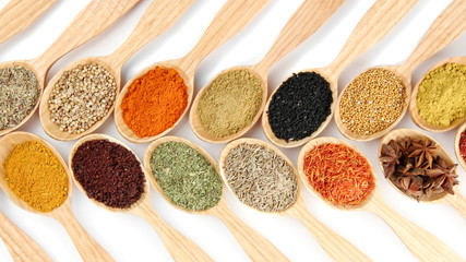 Assortment of spices in wooden spoons