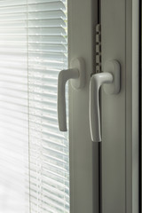 Closed blinds and window handles