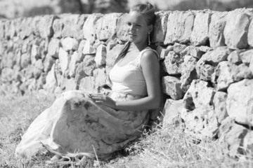 young woman is near a wall