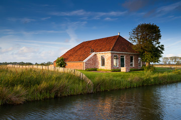Fototapeta na wymiar charming farmhouse in sunlight