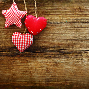 Valentines vintage hearts on wooden background, retro styled wal