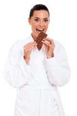 young woman eating chocolate