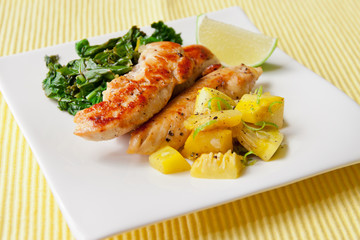 Roasted chicken breast with saute kale and squash vegetables
