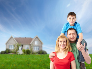 Fototapeta premium Happy family near new house.