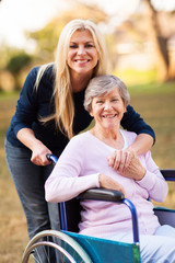 senior woman in a wheelchair and her daugther