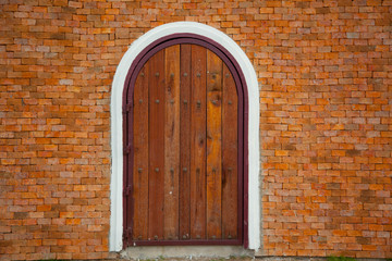 door on Red brick wall background
