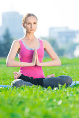 Woman doing stretching fitness exercise Yoga. lotus