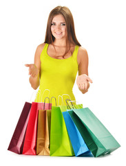 Young happy woman with colorful paper shopping bags isolated