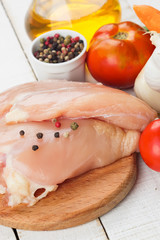 Fresh chicken on wooden table