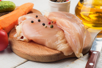 Fresh chicken on wooden table