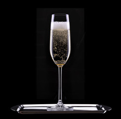 glass of champagne isolated on black background