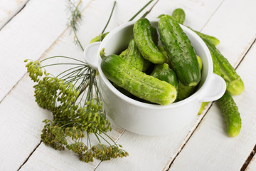 Fresh cucumbers on wooden background