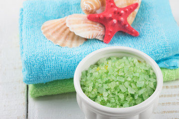 Sea salt in bowl  on wooden background