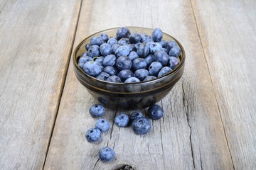 Fresh bilberries on wooden ground