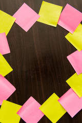 Many reminder notes on the wooden background