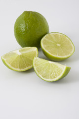 Whole and sliced limes