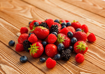Berries on Wooden Background.
