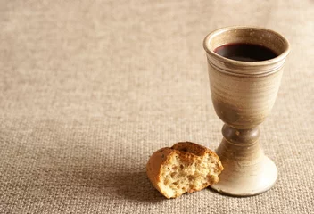 Gordijnen Chalice with wine and bread. Background with copy space © Magdalena Kucova
