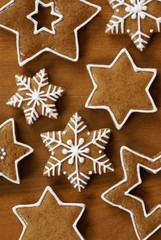 Various gingerbread stars on wooden background