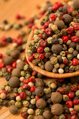 Peppercorn mix in a wooden spoon
