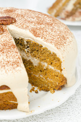 carrots and pumpkin cake with coffee cream in a cut