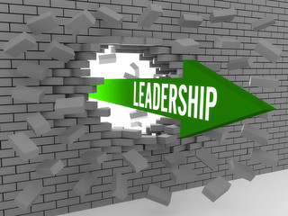 Arrow with word Leadership breaking brick wall.