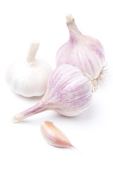 Three bulbs of garlic isolated on white, selective focus