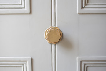 Cream door with brass knob