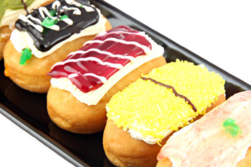 Close-up Sushi donut in the black dish.