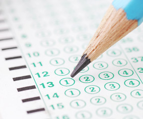 Pencils point at choice No.1  on blank test sheet close up