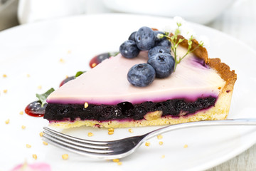 piece of blueberry pie on a table in a restaurant