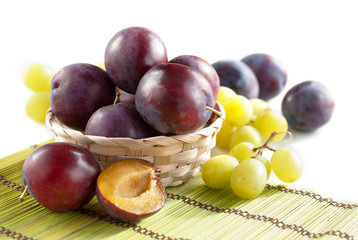 Fresh plums and grapes