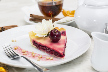 piece of cherry pie on a table in a restaurant