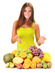 Young woman with assorted fruits isolated on white