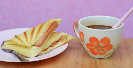 cup with bread Sausage in morning