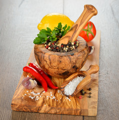 Spices, wooden mortar and vegetables