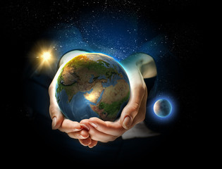 Earth planet in hands