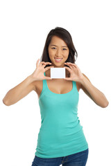 Fototapeta premium Beautiful Asian girl holding blank paper